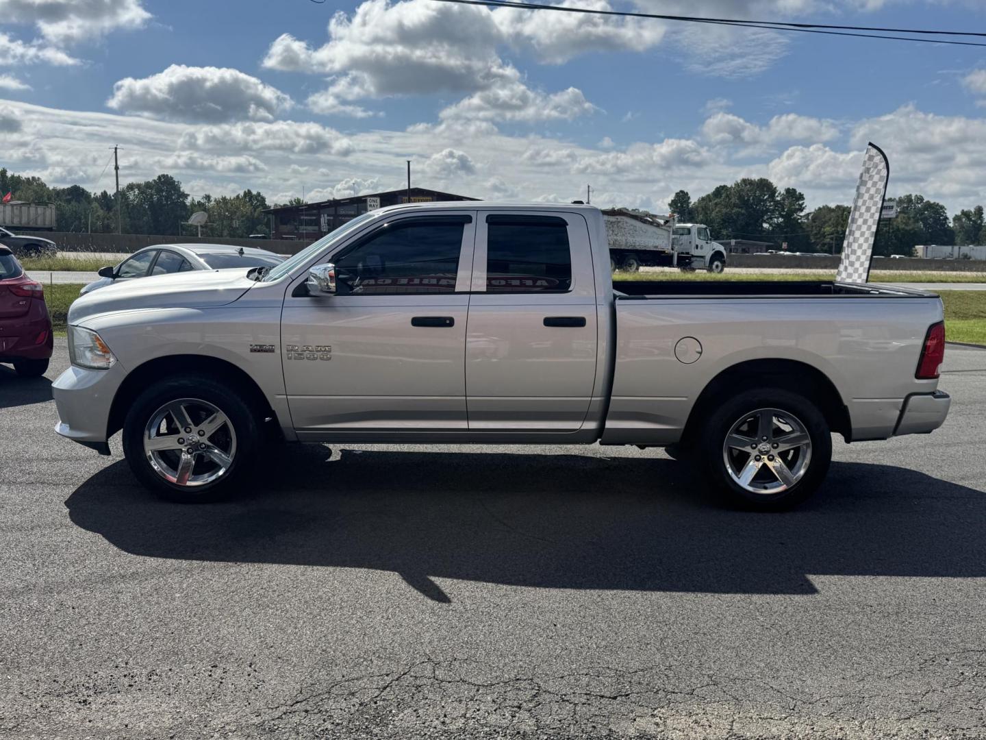 2013 Silver Ram 1500 Quad Cab (1C6RR6FT2DS) with an V8, HEMI, 5.7 Liter engine, Automatic, 6-Spd transmission, located at 8008 Warden Rd, Sherwood, AR, 72120, (501) 801-6100, 34.830078, -92.186684 - Photo#4
