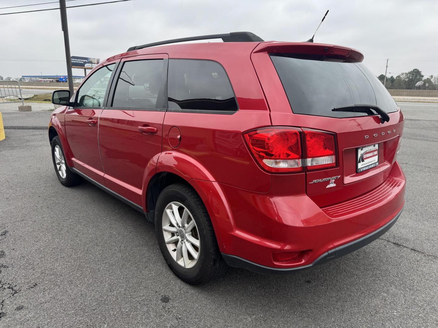 2016 Red Dodge Journey (3C4PDCBBXGT) with an 4-Cyl, 2.4 Liter engine, Auto, 6-Spd AutoStick transmission, located at 8008 Warden Rd, Sherwood, AR, 72120, (501) 801-6100, 34.830078, -92.186684 - Photo#5