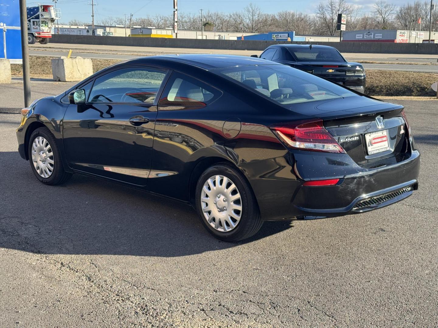 2015 Black Honda Civic (2HGFG3B51FH) with an 4-Cyl, i-VTEC, 1.8 Liter engine, Automatic, CVT transmission, located at 8008 Warden Rd, Sherwood, AR, 72120, (501) 801-6100, 34.830078, -92.186684 - Photo#4