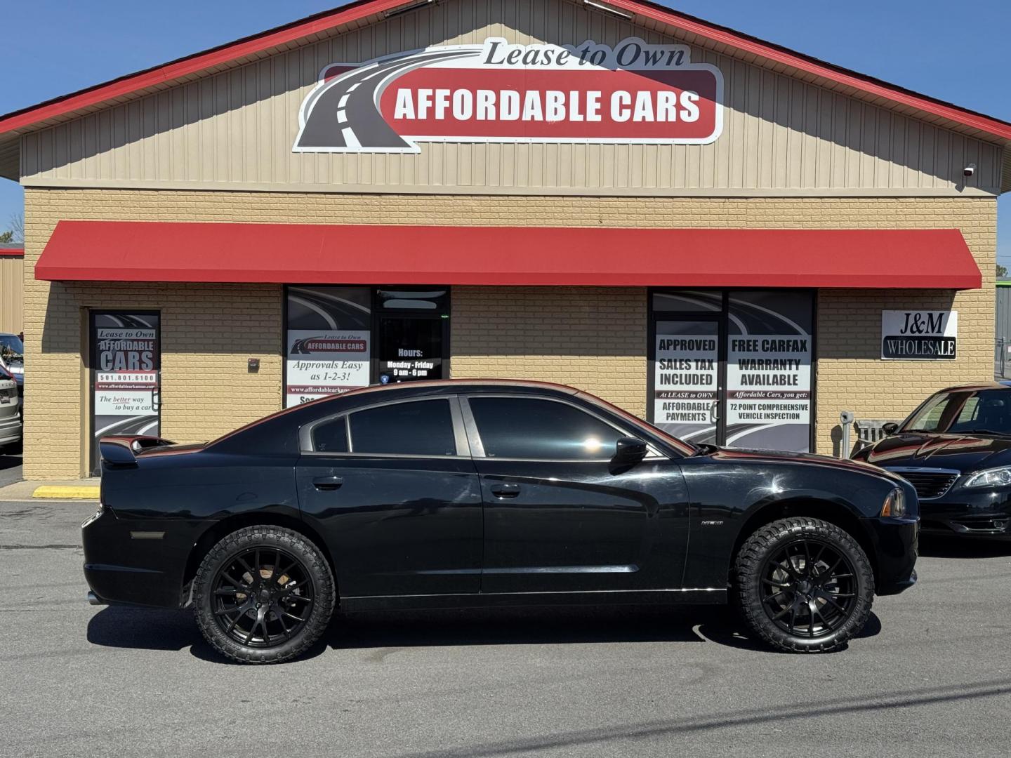 2014 Black Dodge Charger (2C3CDXDT5EH) with an V8, HEMI, 5.7 Liter engine, Automatic, 5-Spd transmission, located at 8008 Warden Rd, Sherwood, AR, 72120, (501) 801-6100, 34.830078, -92.186684 - Photo#0