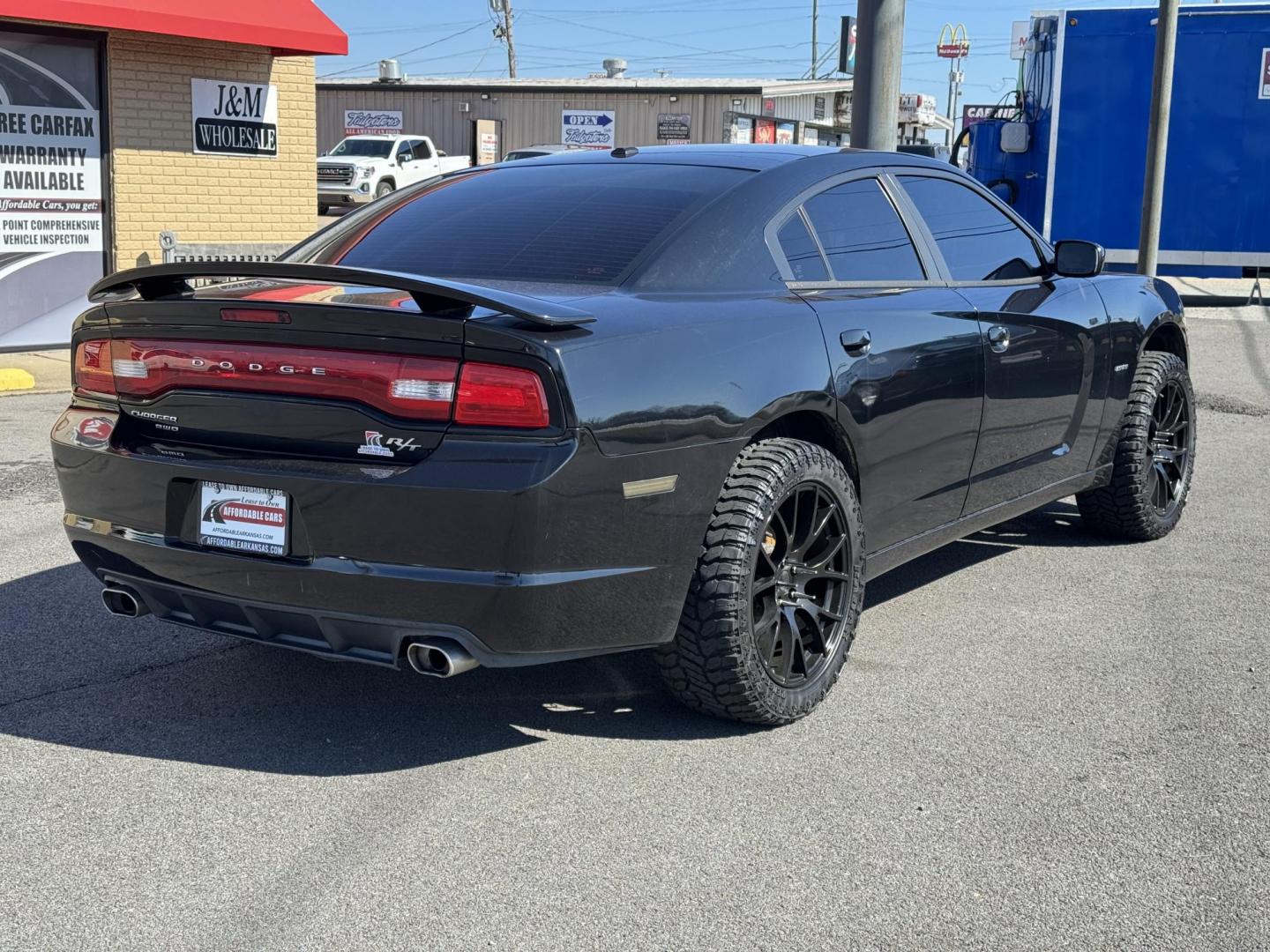 2014 Black Dodge Charger (2C3CDXDT5EH) with an V8, HEMI, 5.7 Liter engine, Automatic, 5-Spd transmission, located at 8008 Warden Rd, Sherwood, AR, 72120, (501) 801-6100, 34.830078, -92.186684 - Photo#7