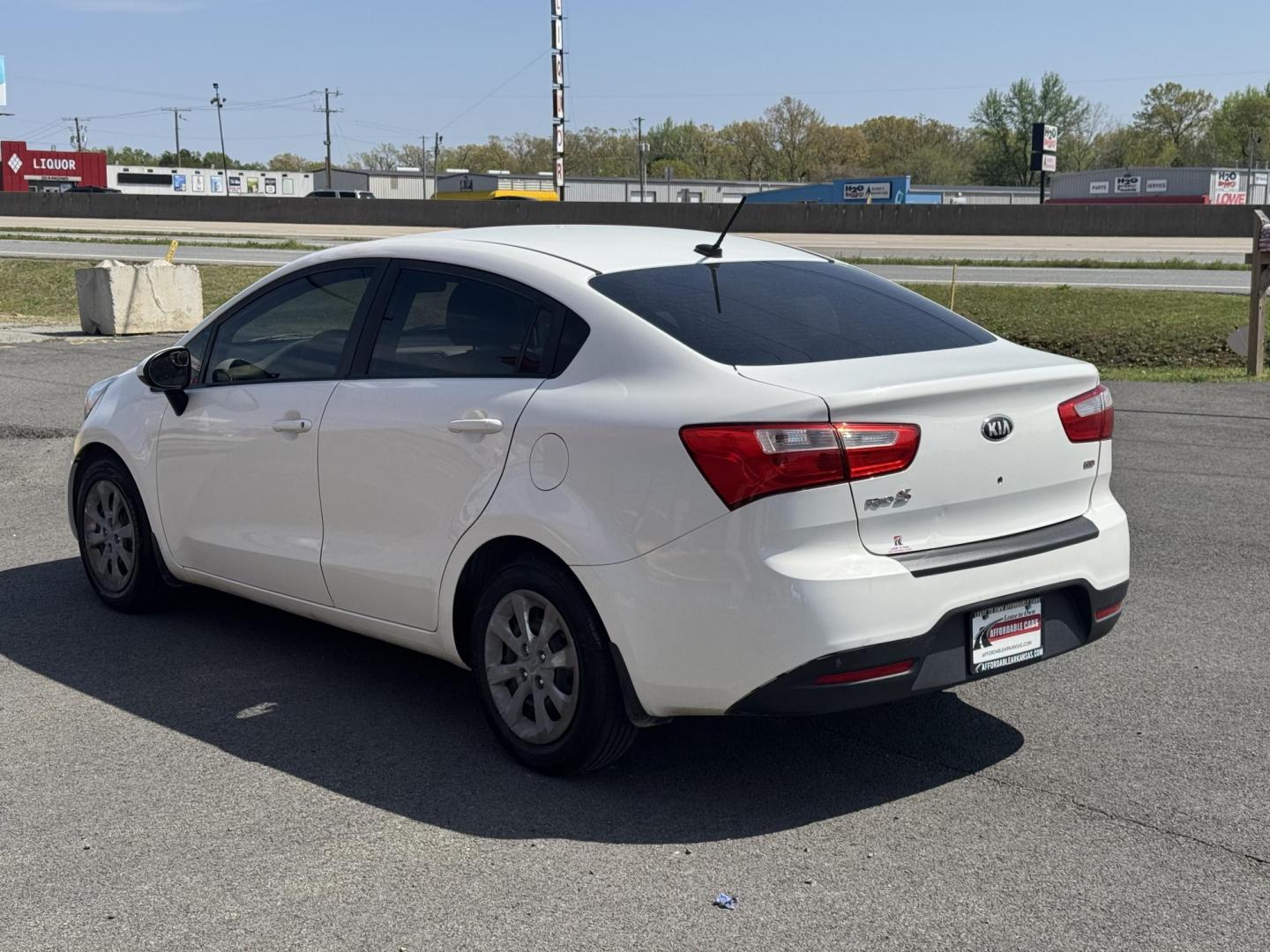 2013 White Kia Rio (KNADM4A34D6) with an 4-Cyl, 1.6 Liter engine, Automatic, 6-Spd transmission, located at 8008 Warden Rd, Sherwood, AR, 72120, (501) 801-6100, 34.830078, -92.186684 - Photo#5