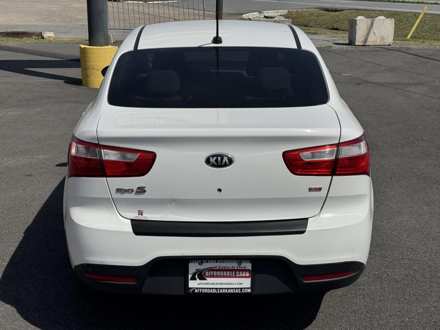 2013 White Kia Rio (KNADM4A34D6) with an 4-Cyl, 1.6 Liter engine, Automatic, 6-Spd transmission, located at 8008 Warden Rd, Sherwood, AR, 72120, (501) 801-6100, 34.830078, -92.186684 - Photo#6