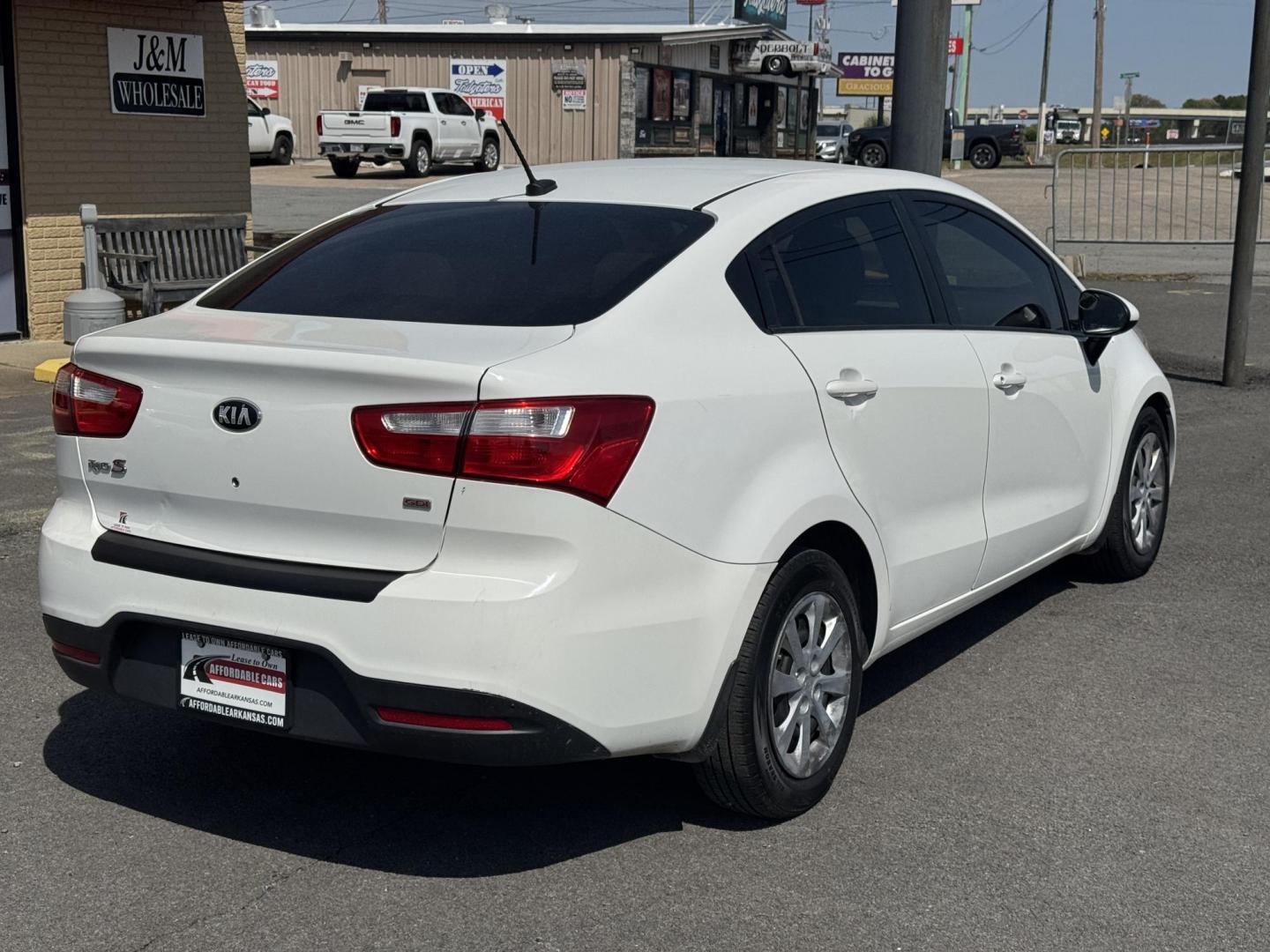 2013 White Kia Rio (KNADM4A34D6) with an 4-Cyl, 1.6 Liter engine, Automatic, 6-Spd transmission, located at 8008 Warden Rd, Sherwood, AR, 72120, (501) 801-6100, 34.830078, -92.186684 - Photo#7
