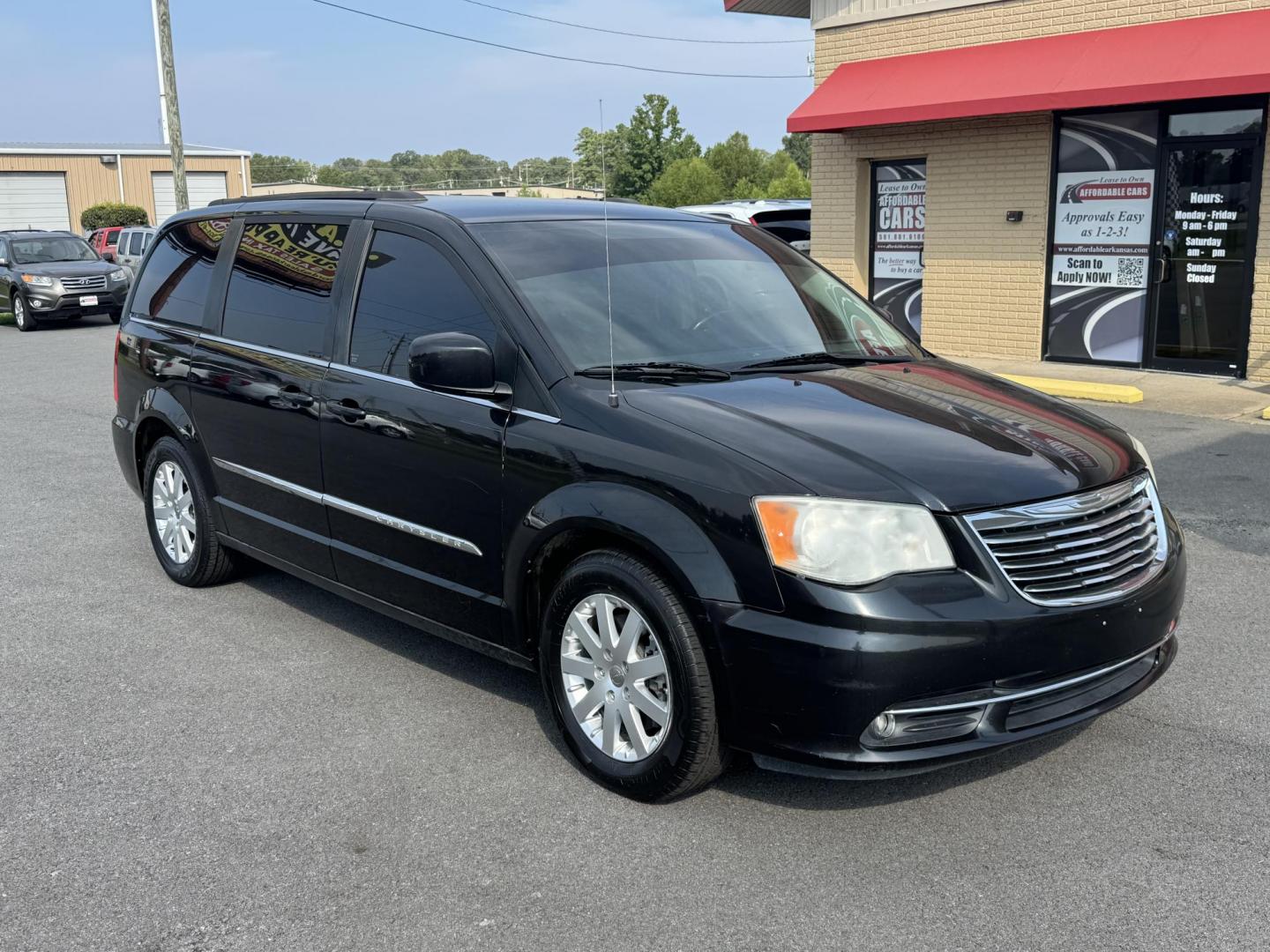 2013 Black Chrysler Town and Country (2C4RC1BG3DR) with an V6, 3.6 Liter engine, Auto, 6-Spd AutoStick transmission, located at 8008 Warden Rd, Sherwood, AR, 72120, (501) 801-6100, 34.830078, -92.186684 - Photo#1