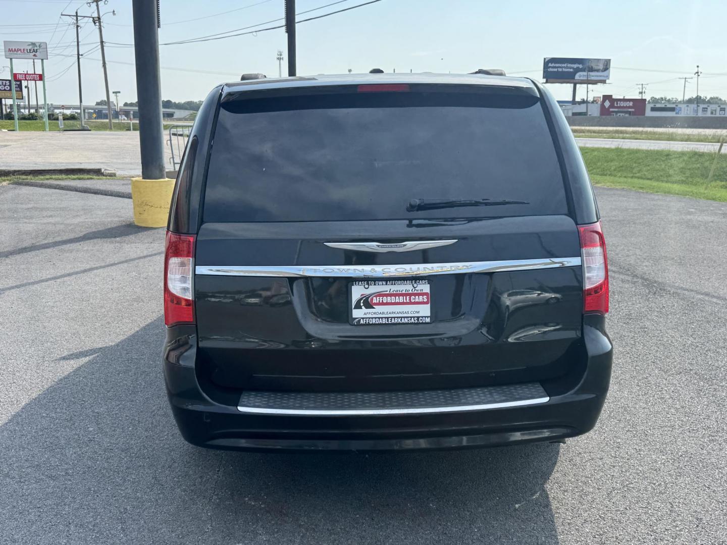 2013 Black Chrysler Town and Country (2C4RC1BG3DR) with an V6, 3.6 Liter engine, Auto, 6-Spd AutoStick transmission, located at 8008 Warden Rd, Sherwood, AR, 72120, (501) 801-6100, 34.830078, -92.186684 - Photo#6