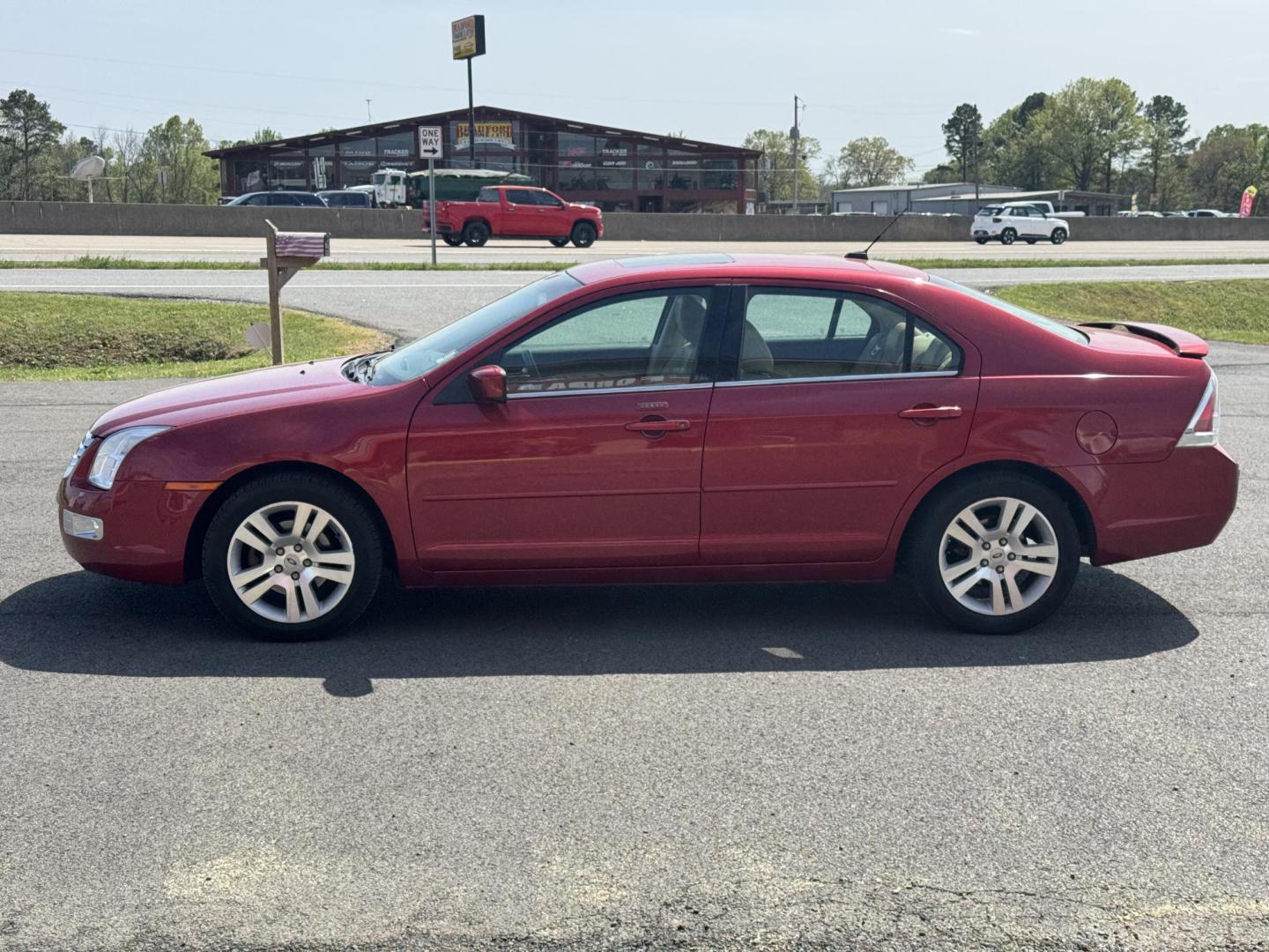 2009 Maroon Ford Fusion (3FAHP08139R) with an V6, 3.0 Liter engine, Automatic, 6-Spd w/Overdrive transmission, located at 8008 Warden Rd, Sherwood, AR, 72120, (501) 801-6100, 34.830078, -92.186684 - Photo#4