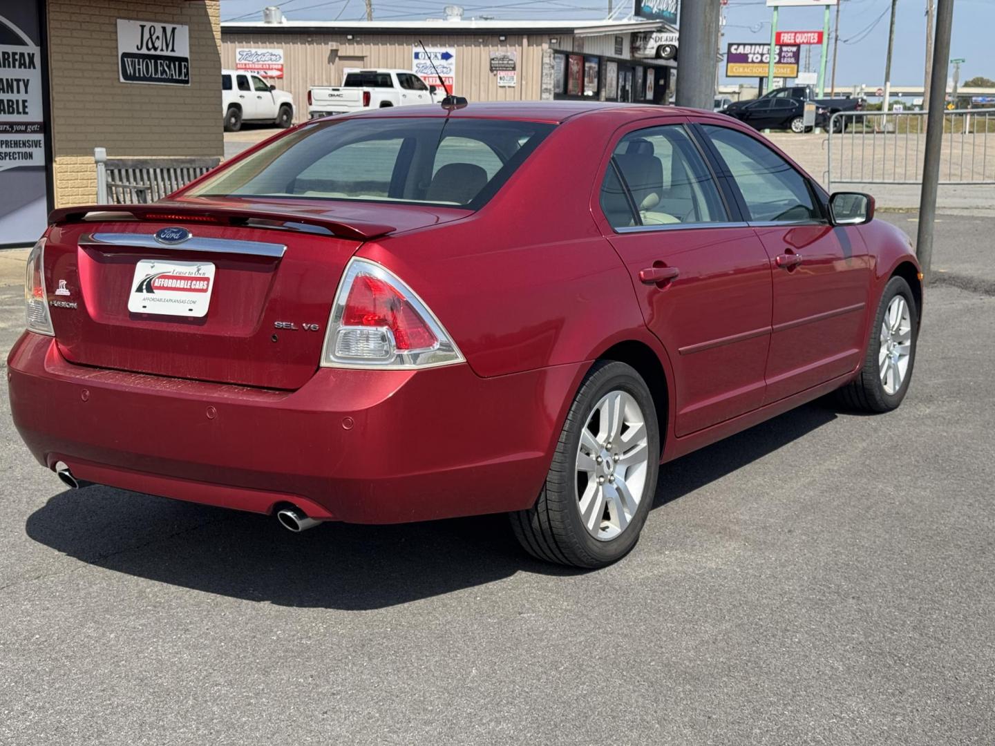 2009 Maroon Ford Fusion (3FAHP08139R) with an V6, 3.0 Liter engine, Automatic, 6-Spd w/Overdrive transmission, located at 8008 Warden Rd, Sherwood, AR, 72120, (501) 801-6100, 34.830078, -92.186684 - Photo#7