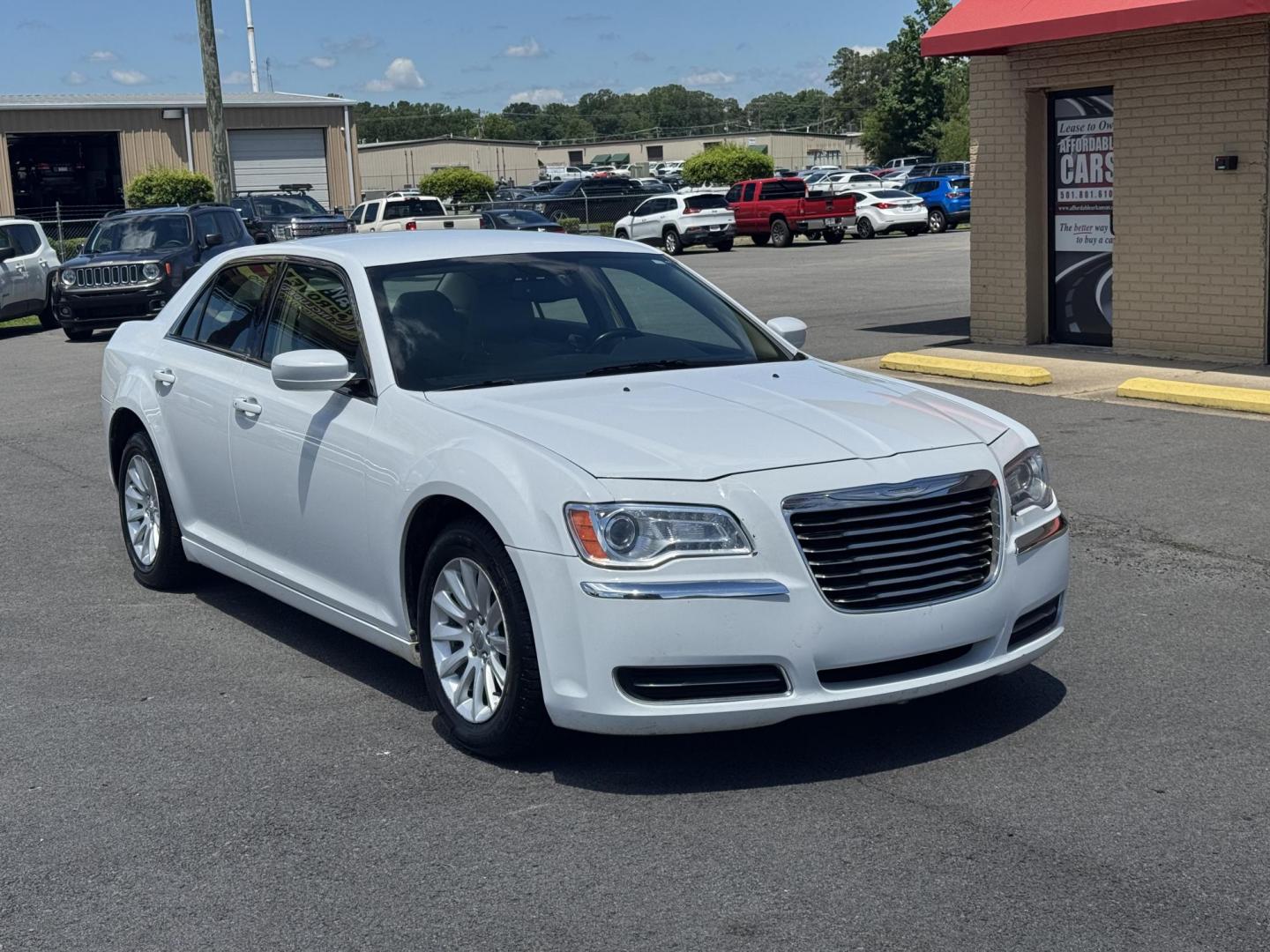 2014 White Chrysler 300 (2C3CCAAG3EH) with an V6, 3.6 Liter engine, Automatic, 8-Spd transmission, located at 8008 Warden Rd, Sherwood, AR, 72120, (501) 801-6100, 34.830078, -92.186684 - Photo#1