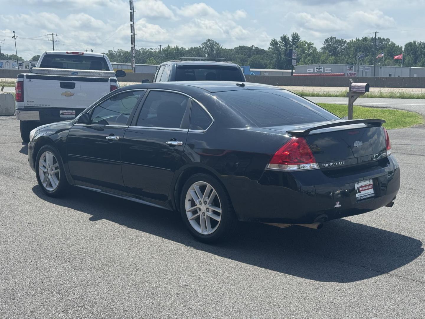 2013 Black Chevrolet Impala (2G1WC5E31D1) with an V6, 3.6 Liter engine, Auto, 6-Spd Overdrive transmission, located at 8008 Warden Rd, Sherwood, AR, 72120, (501) 801-6100, 34.830078, -92.186684 - Photo#5