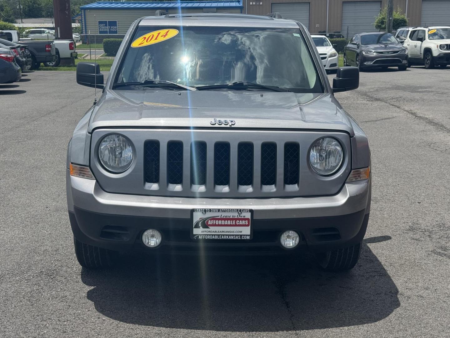 2014 Gray Jeep Patriot (1C4NJPBA8ED) with an 4-Cyl, 2.0 Liter engine, Automatic, 6-Spd w/AutoStick transmission, located at 8008 Warden Rd, Sherwood, AR, 72120, (501) 801-6100, 34.830078, -92.186684 - Photo#1