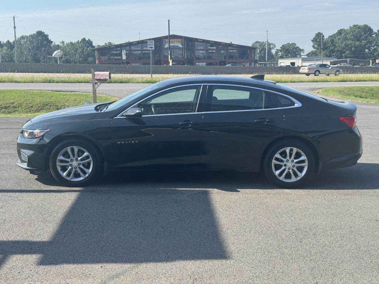 2016 Black Chevrolet Malibu (1G1ZE5ST1GF) with an 4-Cyl, Turbo, 1.5 Liter engine, Automatic, 6-Spd transmission, located at 8008 Warden Rd, Sherwood, AR, 72120, (501) 801-6100, 34.830078, -92.186684 - Photo#4
