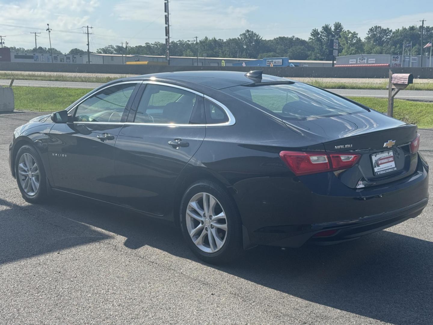 2016 Black Chevrolet Malibu (1G1ZE5ST1GF) with an 4-Cyl, Turbo, 1.5 Liter engine, Automatic, 6-Spd transmission, located at 8008 Warden Rd, Sherwood, AR, 72120, (501) 801-6100, 34.830078, -92.186684 - Photo#5