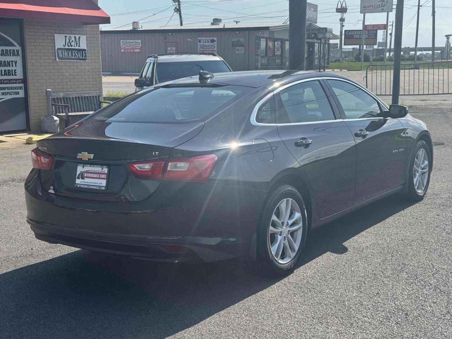 2016 Black Chevrolet Malibu (1G1ZE5ST1GF) with an 4-Cyl, Turbo, 1.5 Liter engine, Automatic, 6-Spd transmission, located at 8008 Warden Rd, Sherwood, AR, 72120, (501) 801-6100, 34.830078, -92.186684 - Photo#7