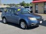 2009 Blue Subaru Forester (JF2SH61639H) with an 4-Cyl, 2.5 Liter engine, Automatic, 4-Spd w/Overdrive and SportShift transmission, located at 8008 Warden Rd, Sherwood, AR, 72120, (501) 801-6100, 34.830078, -92.186684 - Photo#1