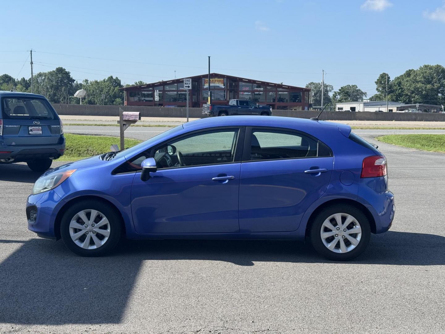 2012 Blue Kia Rio (KNADN5A34C6) with an 4-Cyl, 1.6 Liter engine, Automatic, 6-Spd w/Overdrive transmission, located at 8008 Warden Rd, Sherwood, AR, 72120, (501) 801-6100, 34.830078, -92.186684 - Photo#4