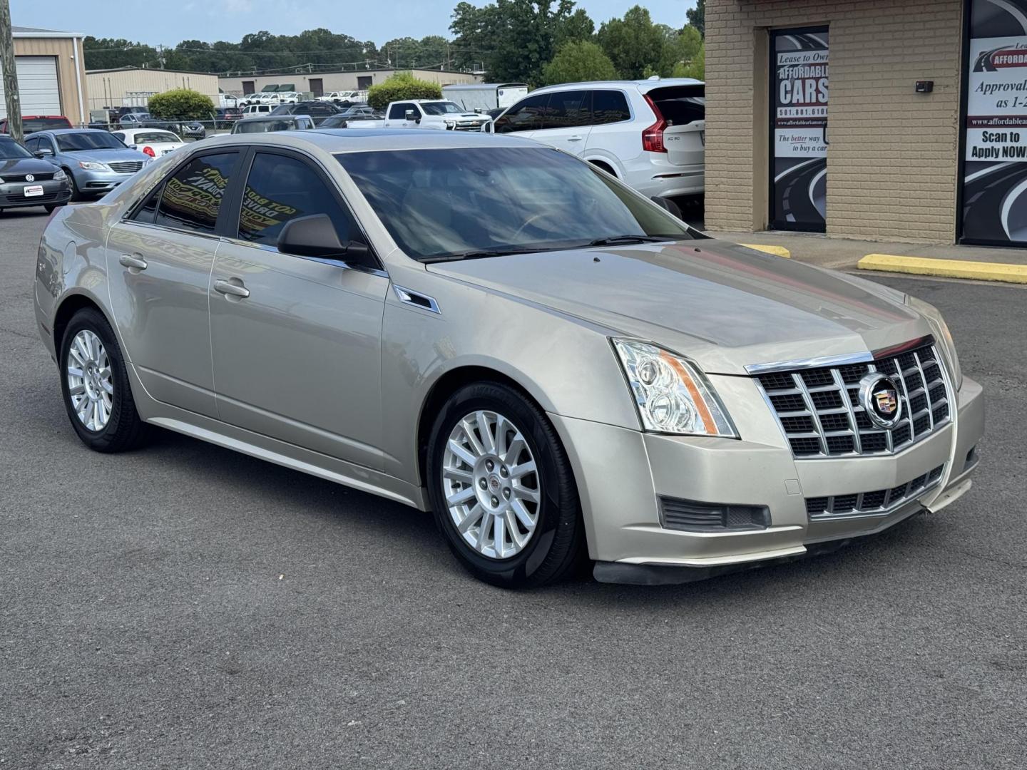 2013 Gold Cadillac CTS (1G6DE5E5XD0) with an V6, 3.0 Liter engine, Automatic, 6-Spd transmission, located at 8008 Warden Rd, Sherwood, AR, 72120, (501) 801-6100, 34.830078, -92.186684 - Photo#1