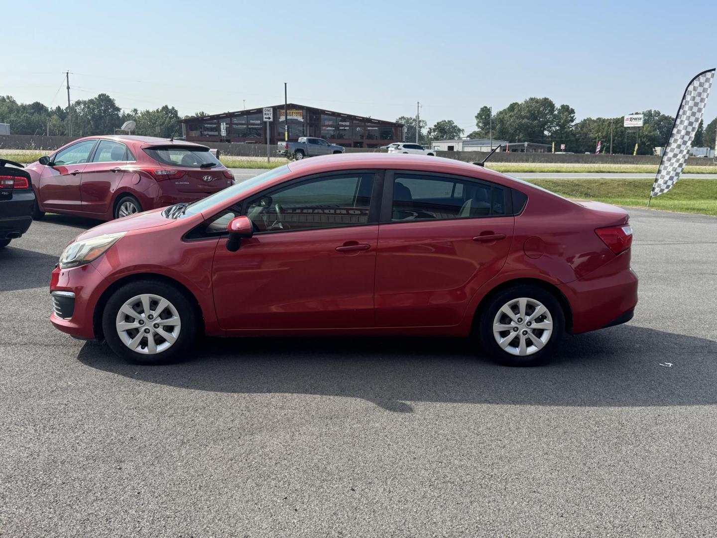 2017 Maroon Kia Rio (KNADM4A37H6) with an 4-Cyl, 1.6 Liter engine, Automatic, 6-Spd transmission, located at 8008 Warden Rd, Sherwood, AR, 72120, (501) 801-6100, 34.830078, -92.186684 - Photo#4