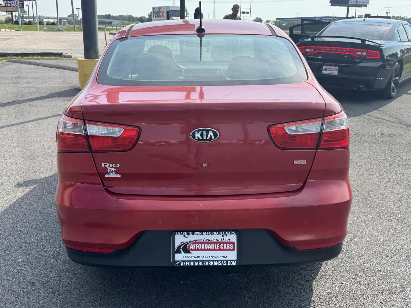 2017 Maroon Kia Rio (KNADM4A37H6) with an 4-Cyl, 1.6 Liter engine, Automatic, 6-Spd transmission, located at 8008 Warden Rd, Sherwood, AR, 72120, (501) 801-6100, 34.830078, -92.186684 - Photo#6