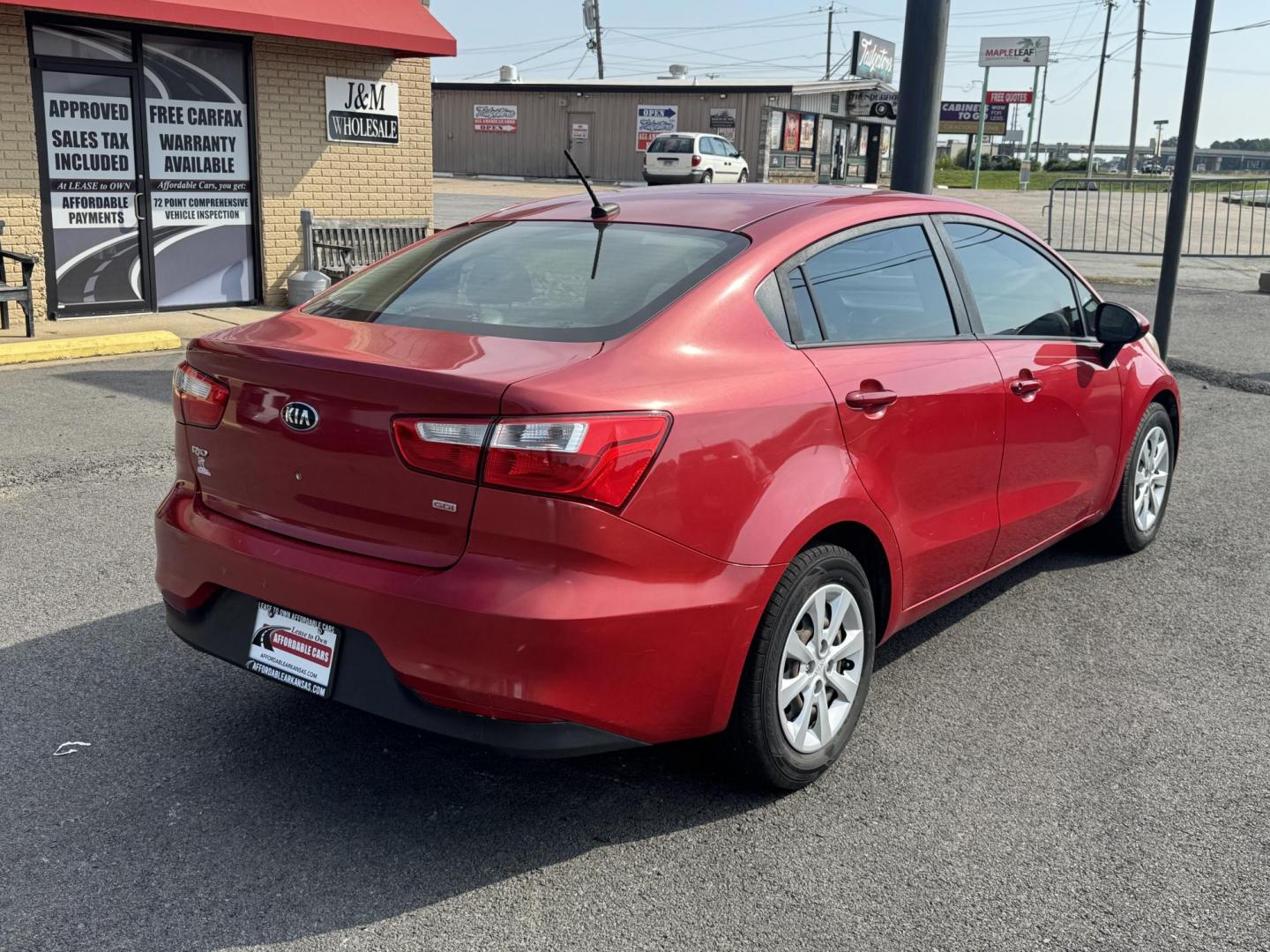 2017 Maroon Kia Rio (KNADM4A37H6) with an 4-Cyl, 1.6 Liter engine, Automatic, 6-Spd transmission, located at 8008 Warden Rd, Sherwood, AR, 72120, (501) 801-6100, 34.830078, -92.186684 - Photo#7