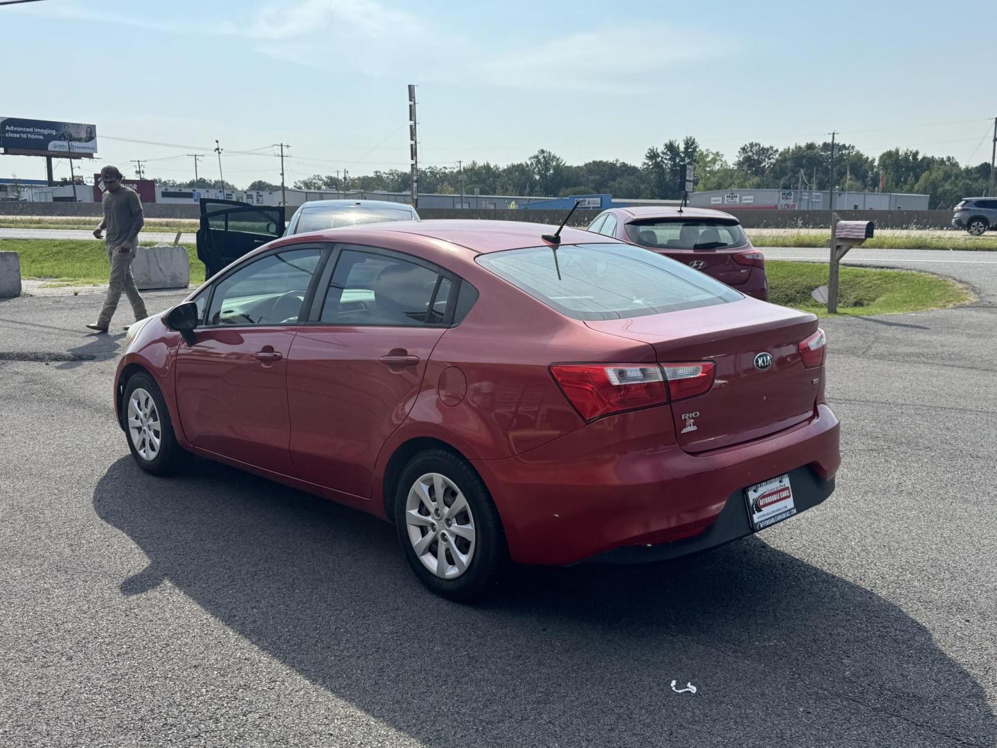 2017 Maroon Kia Rio (KNADM4A37H6) with an 4-Cyl, 1.6 Liter engine, Automatic, 6-Spd transmission, located at 8008 Warden Rd, Sherwood, AR, 72120, (501) 801-6100, 34.830078, -92.186684 - Photo#5