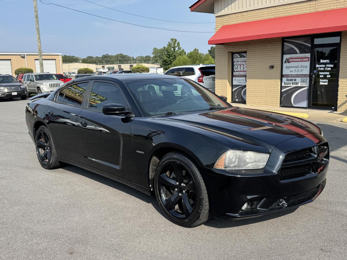 2014 Black Dodge Charger (2C3CDXCT3EH) with an V8, HEMI, 5.7 Liter engine, Automatic, 5-Spd transmission, located at 8008 Warden Rd, Sherwood, AR, 72120, (501) 801-6100, 34.830078, -92.186684 - Photo#1