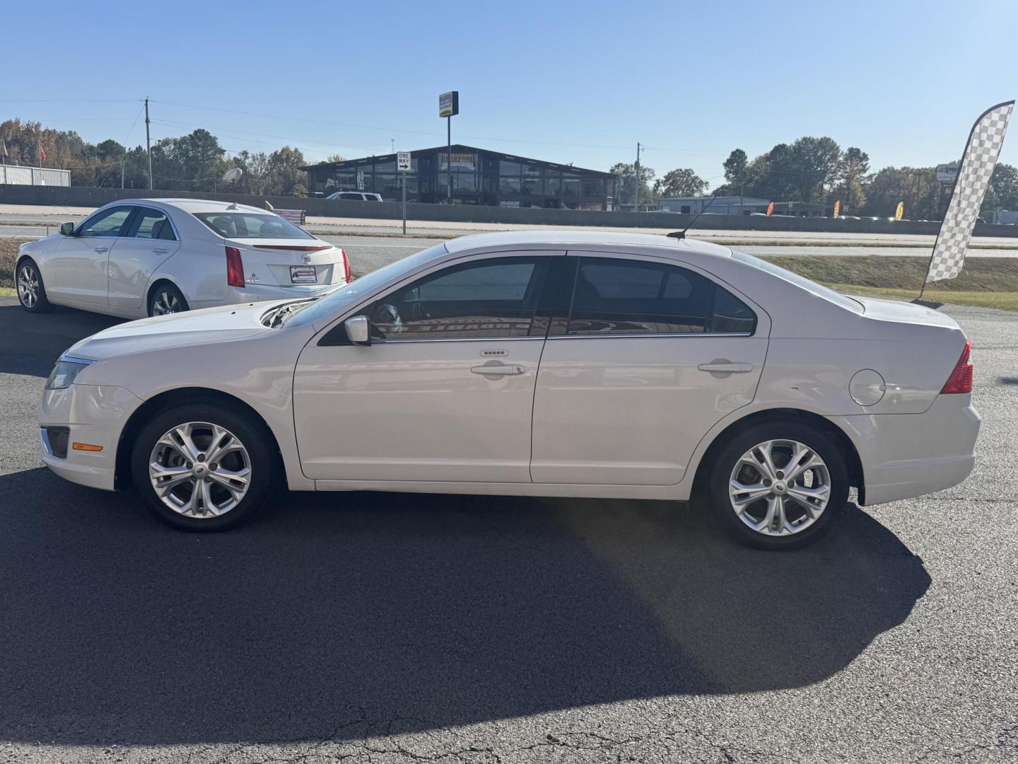 2012 White Ford Fusion (3FAHP0JG5CR) with an 4-Cyl, 2.5 Liter engine, Automatic, 6-Spd w/SelectShift transmission, located at 8008 Warden Rd, Sherwood, AR, 72120, (501) 801-6100, 34.830078, -92.186684 - Photo#4