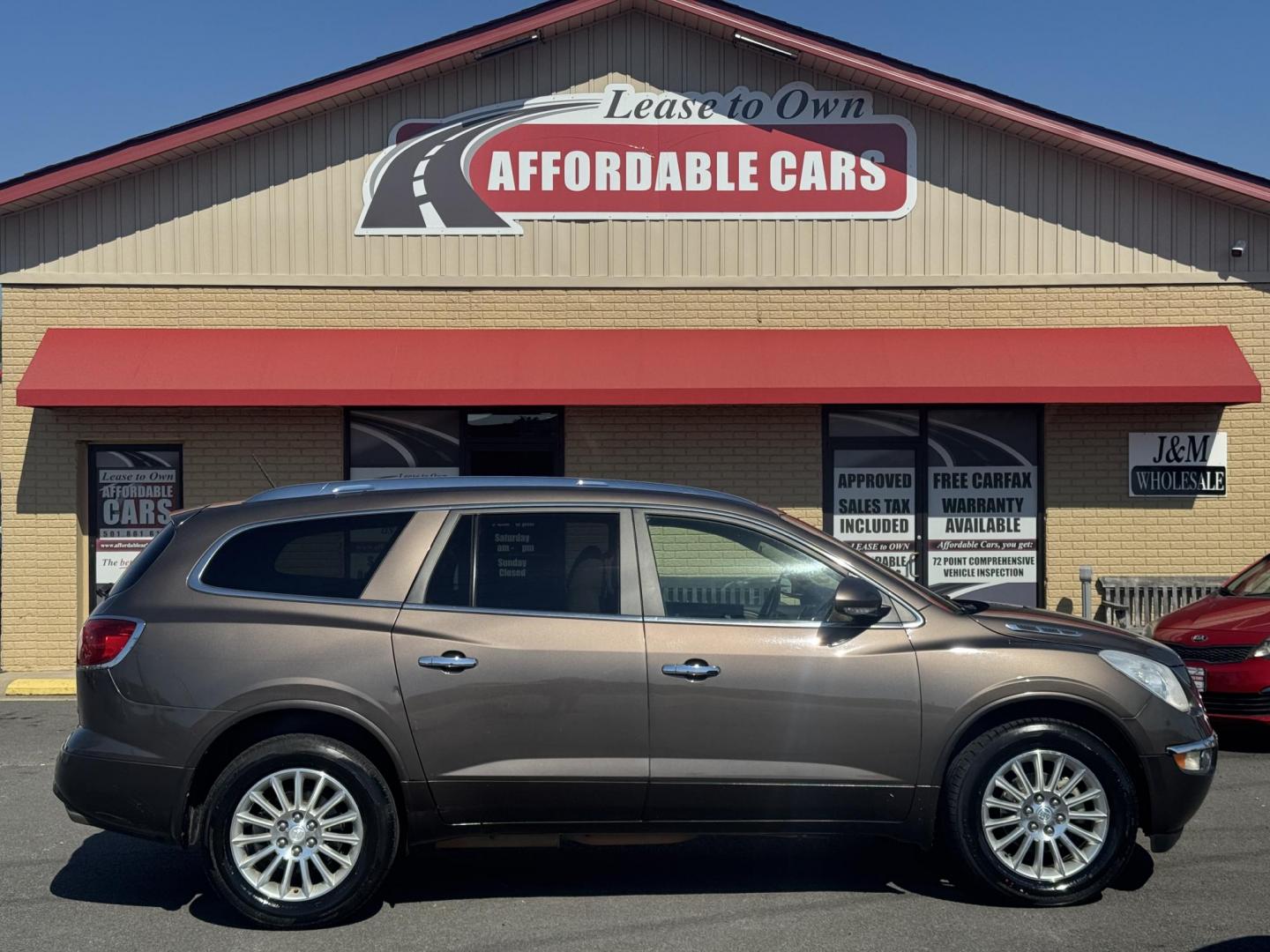 2012 Brown Buick Enclave (5GAKRCED9CJ) with an V6, 3.6 Liter engine, Auto, 6-Spd Overdrive transmission, located at 8008 Warden Rd, Sherwood, AR, 72120, (501) 801-6100, 34.830078, -92.186684 - Photo#0
