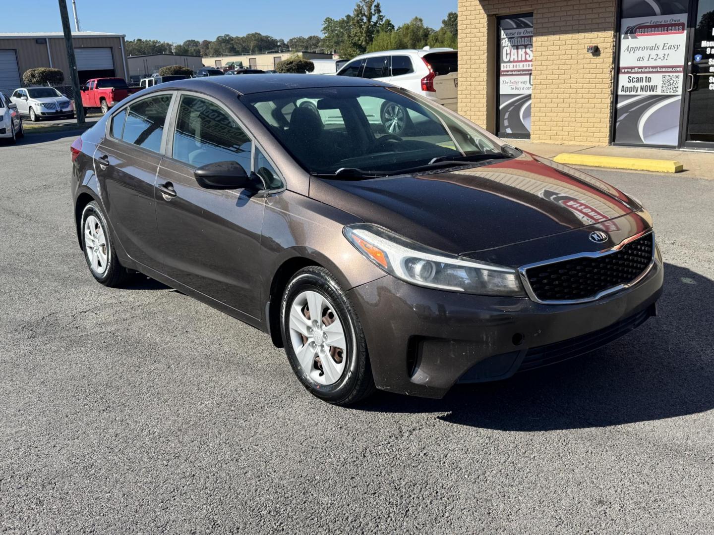 2017 Brown Kia Forte (3KPFL4A73HE) with an 4-Cyl, 2.0 Liter engine, Automatic, 6-Spd transmission, located at 8008 Warden Rd, Sherwood, AR, 72120, (501) 801-6100, 34.830078, -92.186684 - Photo#1