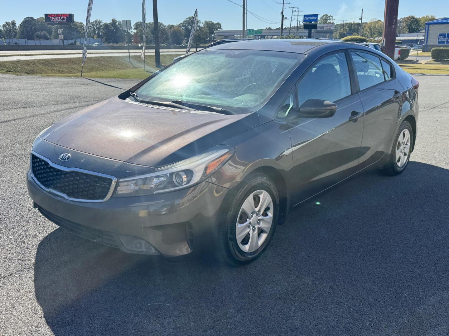 2017 Brown Kia Forte (3KPFL4A73HE) with an 4-Cyl, 2.0 Liter engine, Automatic, 6-Spd transmission, located at 8008 Warden Rd, Sherwood, AR, 72120, (501) 801-6100, 34.830078, -92.186684 - Photo#3