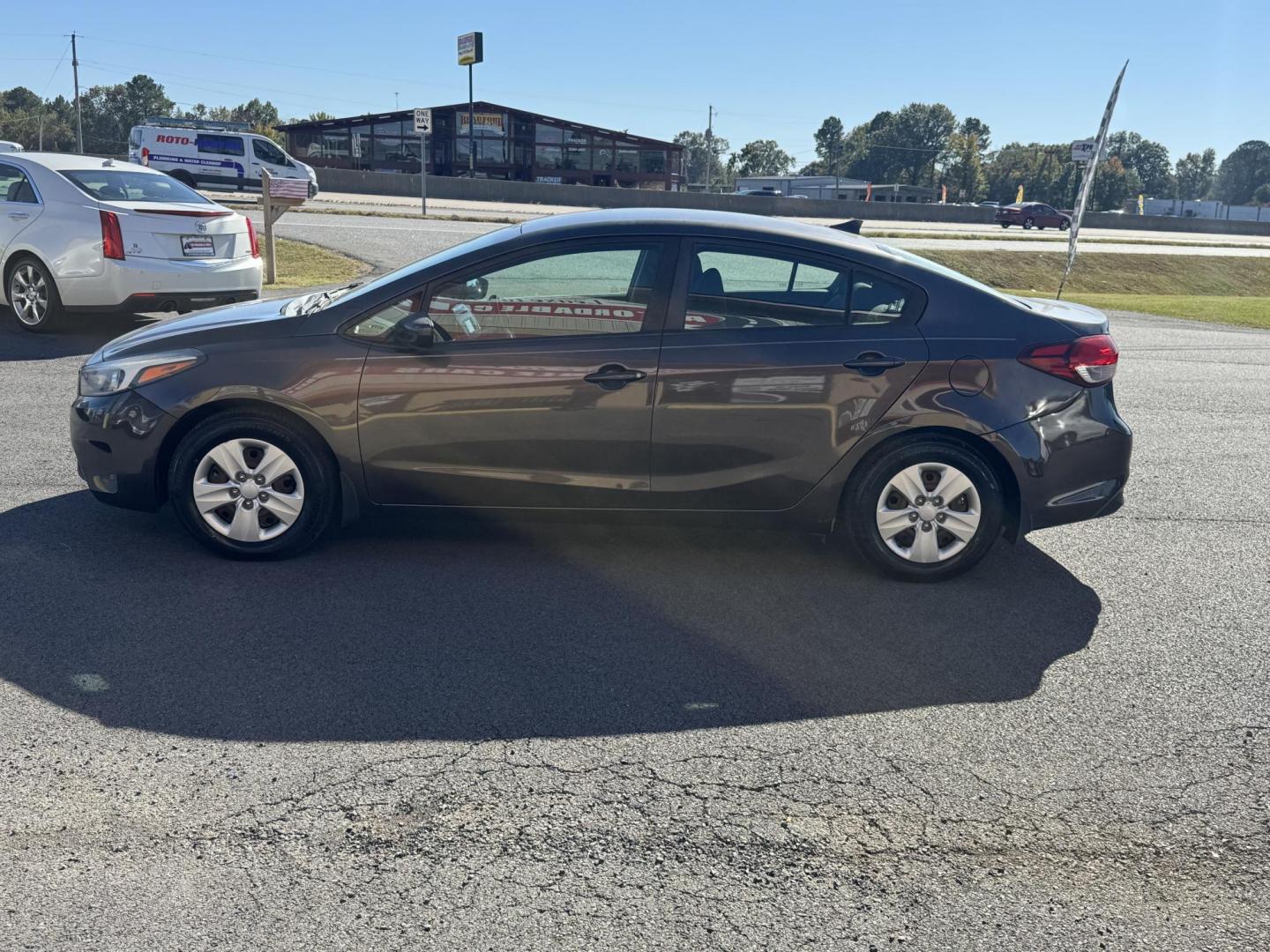 2017 Brown Kia Forte (3KPFL4A73HE) with an 4-Cyl, 2.0 Liter engine, Automatic, 6-Spd transmission, located at 8008 Warden Rd, Sherwood, AR, 72120, (501) 801-6100, 34.830078, -92.186684 - Photo#4