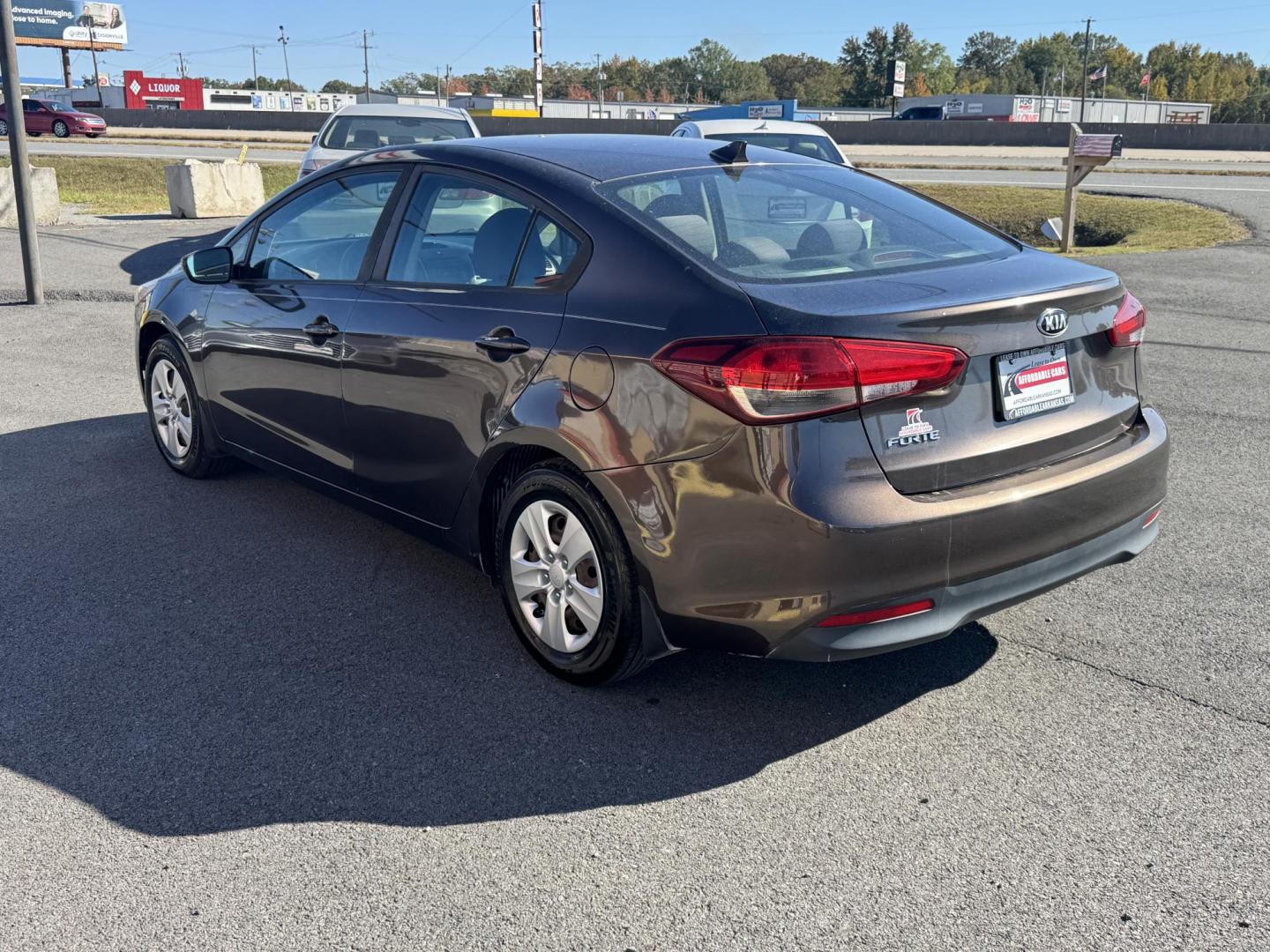 2017 Brown Kia Forte (3KPFL4A73HE) with an 4-Cyl, 2.0 Liter engine, Automatic, 6-Spd transmission, located at 8008 Warden Rd, Sherwood, AR, 72120, (501) 801-6100, 34.830078, -92.186684 - Photo#5