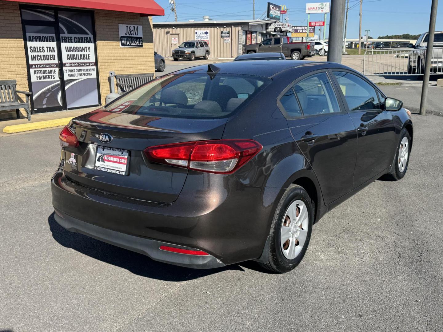 2017 Brown Kia Forte (3KPFL4A73HE) with an 4-Cyl, 2.0 Liter engine, Automatic, 6-Spd transmission, located at 8008 Warden Rd, Sherwood, AR, 72120, (501) 801-6100, 34.830078, -92.186684 - Photo#7