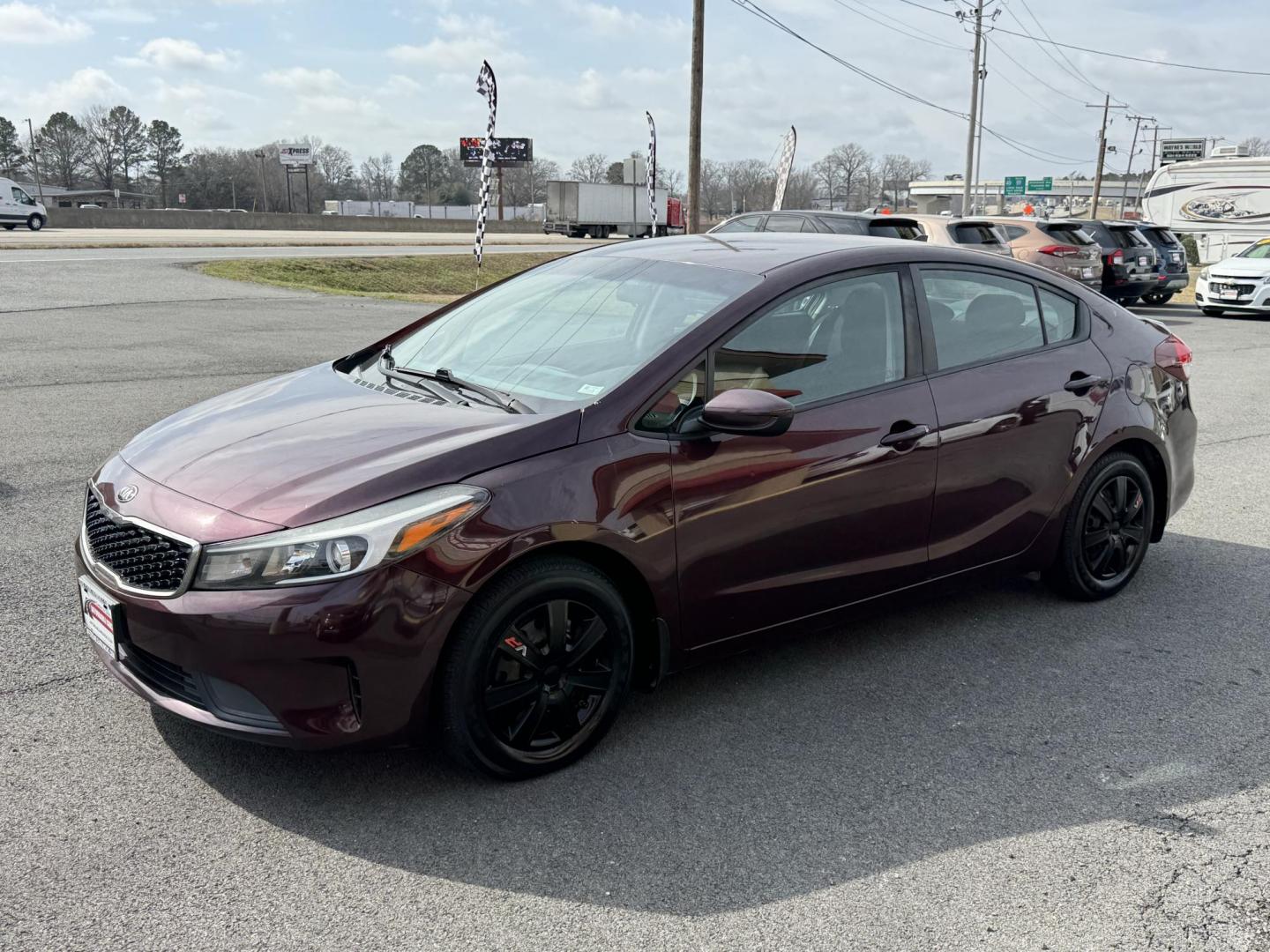 2017 Maroon Kia Forte (3KPFK4A72HE) with an 4-Cyl, 2.0 Liter engine, Automatic, 6-Spd transmission, located at 8008 Warden Rd, Sherwood, AR, 72120, (501) 801-6100, 34.830078, -92.186684 - Photo#3