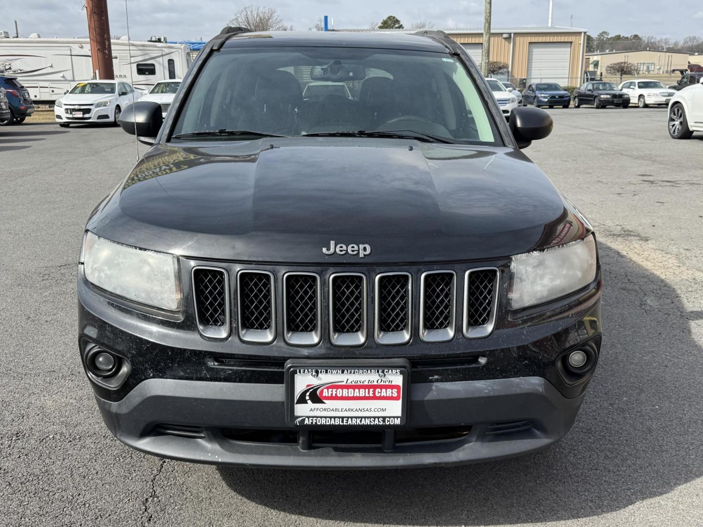 2016 Black Jeep Compass (1C4NJCBA7GD) with an 4-Cyl, 2.4 Liter engine, Auto, 6-Spd AutoStick transmission, located at 8008 Warden Rd, Sherwood, AR, 72120, (501) 801-6100, 34.830078, -92.186684 - Photo#2