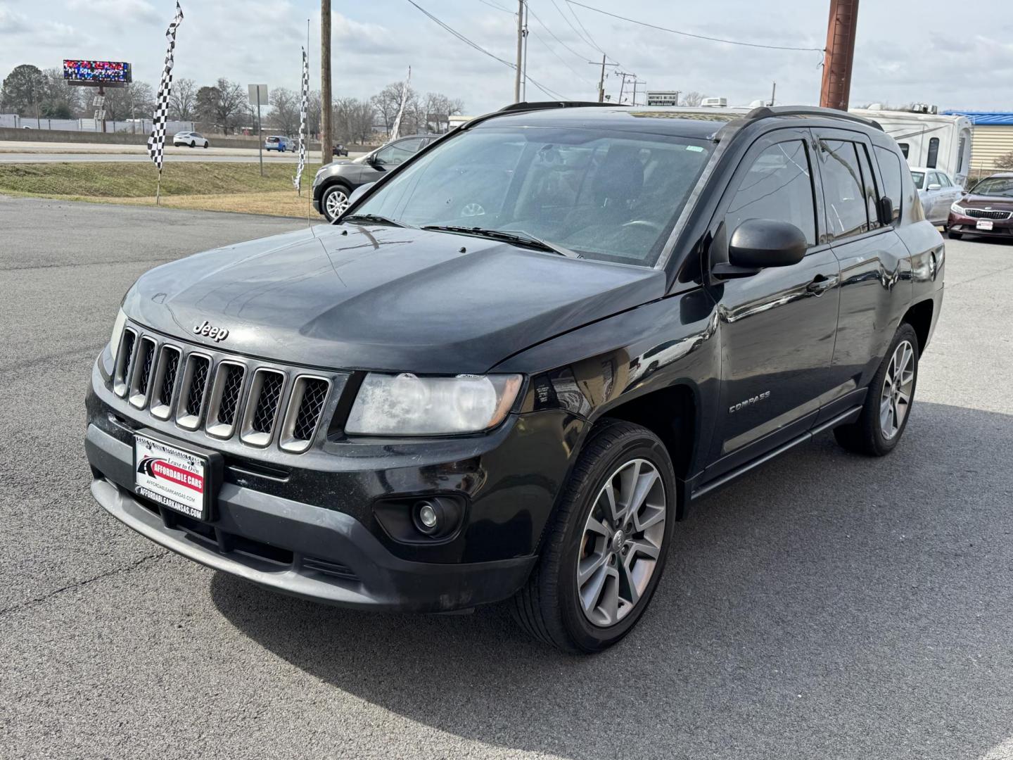 2016 Black Jeep Compass (1C4NJCBA7GD) with an 4-Cyl, 2.4 Liter engine, Auto, 6-Spd AutoStick transmission, located at 8008 Warden Rd, Sherwood, AR, 72120, (501) 801-6100, 34.830078, -92.186684 - Photo#3