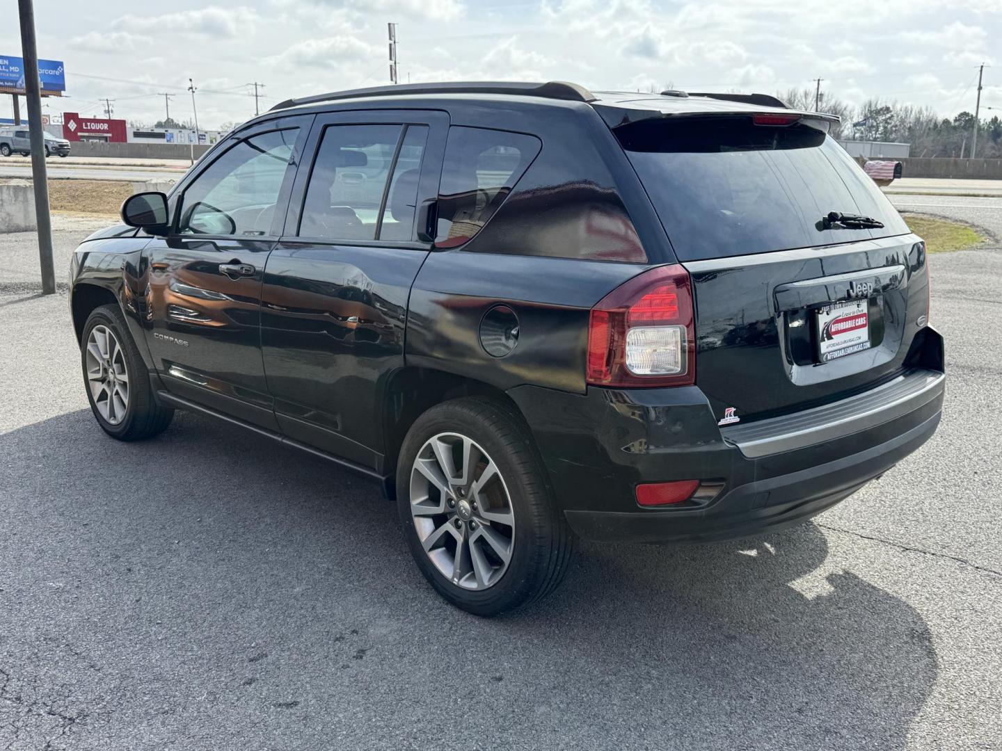 2016 Black Jeep Compass (1C4NJCBA7GD) with an 4-Cyl, 2.4 Liter engine, Auto, 6-Spd AutoStick transmission, located at 8008 Warden Rd, Sherwood, AR, 72120, (501) 801-6100, 34.830078, -92.186684 - Photo#5