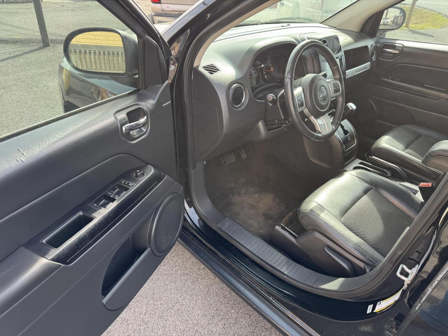 2016 Black Jeep Compass (1C4NJCBA7GD) with an 4-Cyl, 2.4 Liter engine, Auto, 6-Spd AutoStick transmission, located at 8008 Warden Rd, Sherwood, AR, 72120, (501) 801-6100, 34.830078, -92.186684 - Photo#12