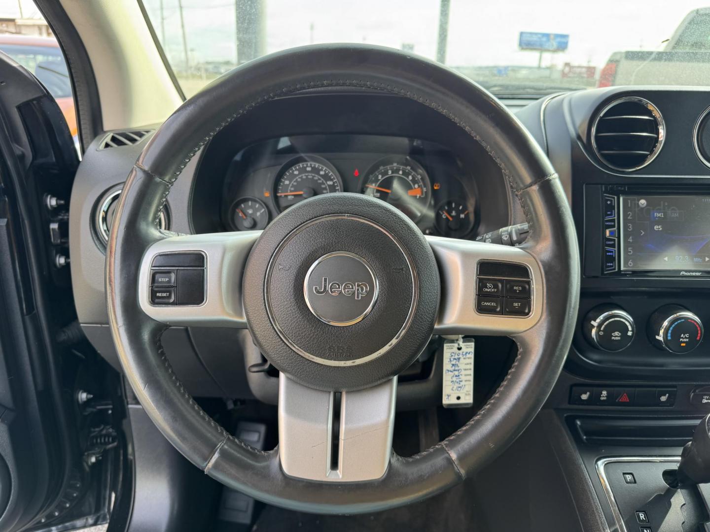 2016 Black Jeep Compass (1C4NJCBA7GD) with an 4-Cyl, 2.4 Liter engine, Auto, 6-Spd AutoStick transmission, located at 8008 Warden Rd, Sherwood, AR, 72120, (501) 801-6100, 34.830078, -92.186684 - Photo#14